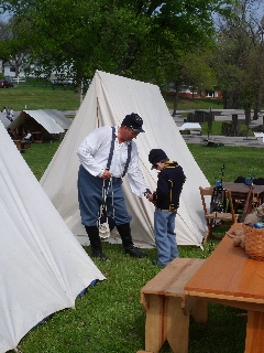 Trooper Scot helping Trooper Hunter prepare for the day
